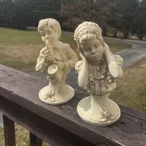 Boy and girl statues